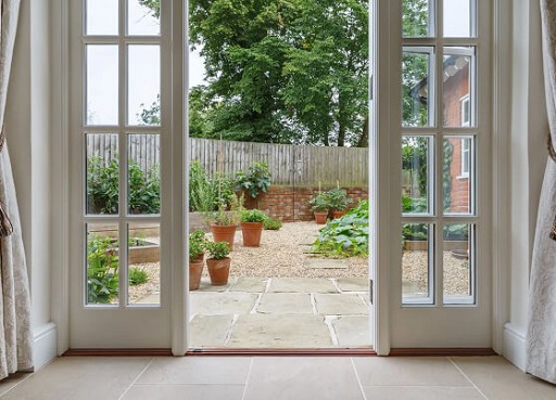 What Causes Patio Door Rollers to Get Stuck?